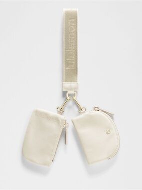 NWT Lululemon light Ivory Dual Pouch Metallic Wordmark Wristlet Keychain Wallet